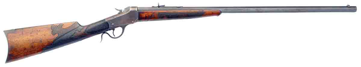 An ideal rifle for just wandering around – what old-time gun writers called “woods loafing.” It is a Winchester Low Wall in .25-20 Single Shot. The stock work was done, presumably, by a talented leather worker, and it gives the rifle an indefinable charm.